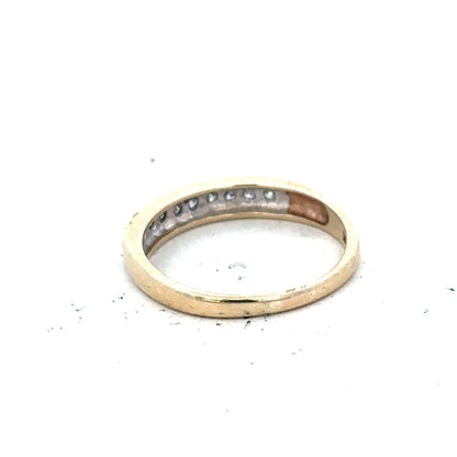 9ct yellow gold diamond ring in size K1/2 with sparkling diamonds, displayed on a neutral background.