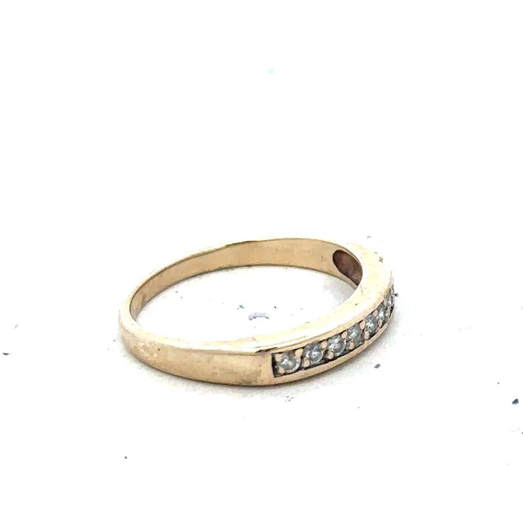 9ct yellow gold diamond ring in size K1/2 with sparkling diamonds, showcasing elegant jewelry craftsmanship.