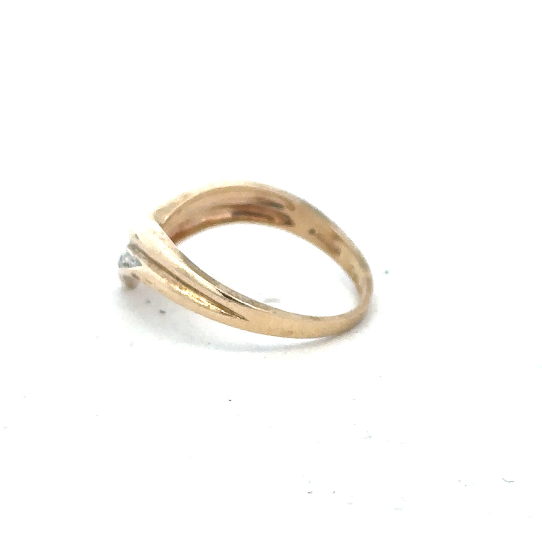 9ct yellow gold diamond ring in size L, featuring a sparkling central diamond and elegant band, unbranded jewelry accessory.