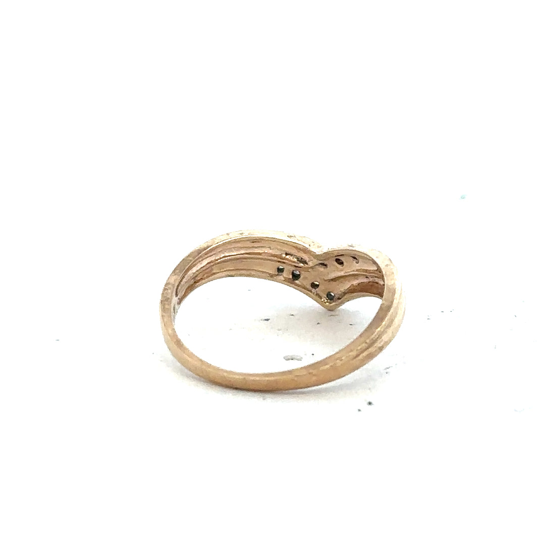 9ct yellow gold diamond ring in size L with sparkling diamonds, unbranded jewelry piece with intricate band design.
