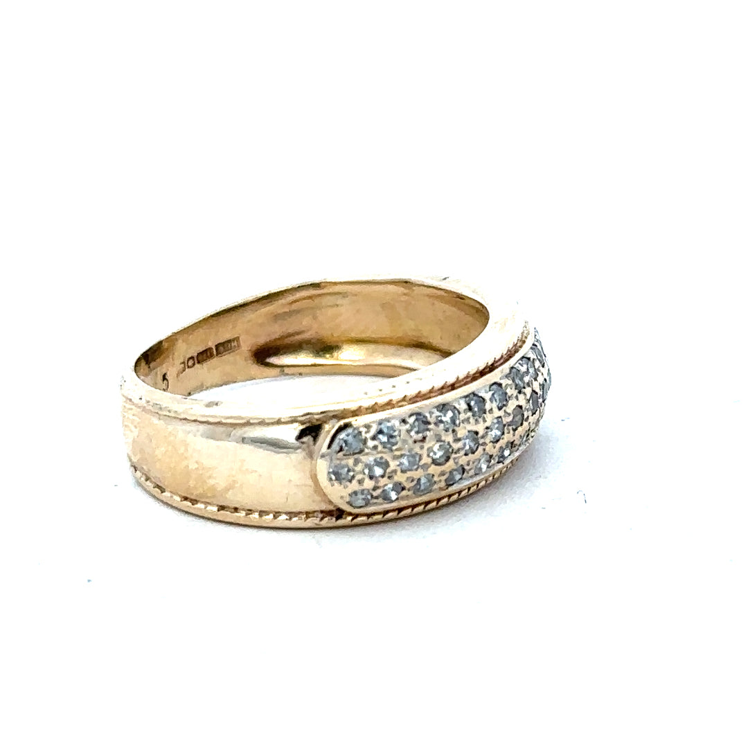 9ct yellow gold diamond ring size M with sparkling diamonds, natural close-up showing detailed craftsmanship and elegant design.