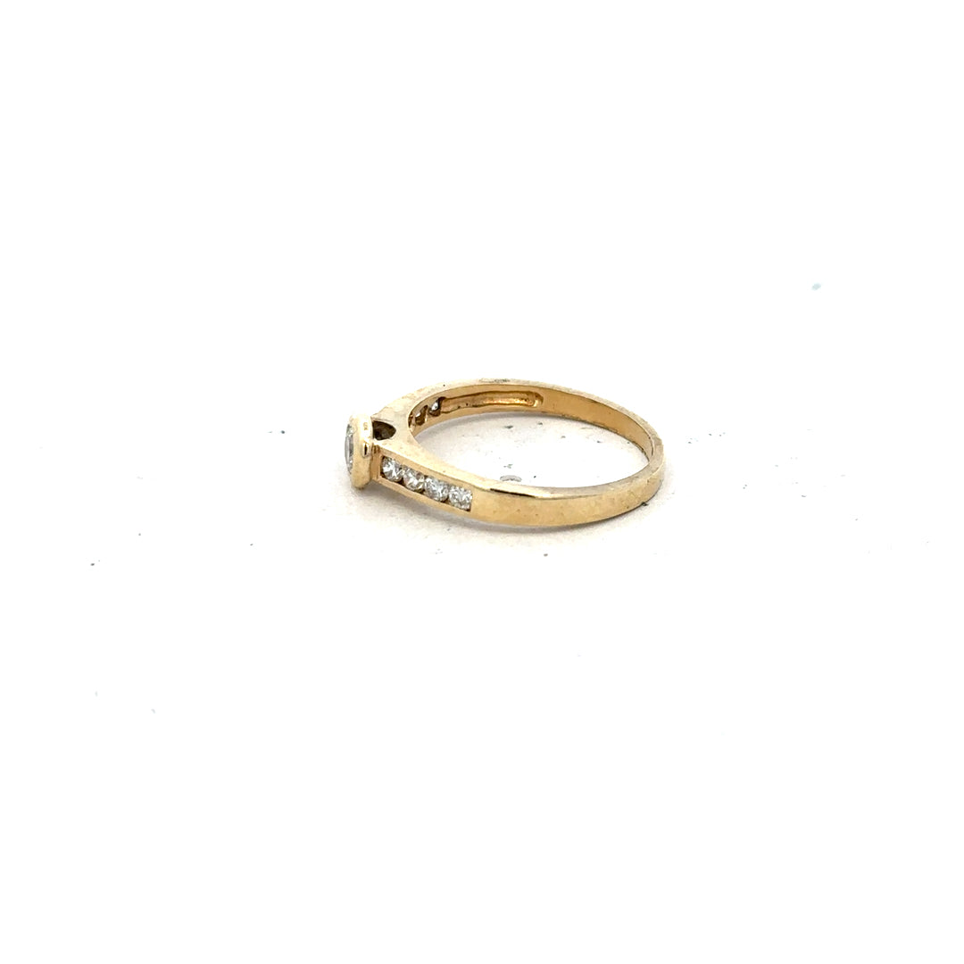 9ct yellow gold diamond ring in size N, featuring a sparkling central diamond and elegant design.