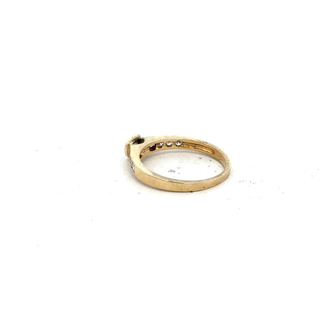 9ct yellow gold diamond ring in size N featuring a sparkling central diamond, unbranded jewelry piece.