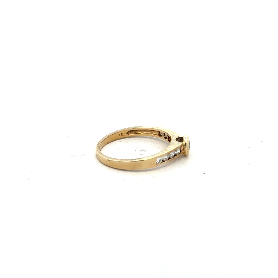 9ct yellow gold diamond ring in size N featuring a sparkling diamond, unbranded jewelry piece with elegant craftsmanship.