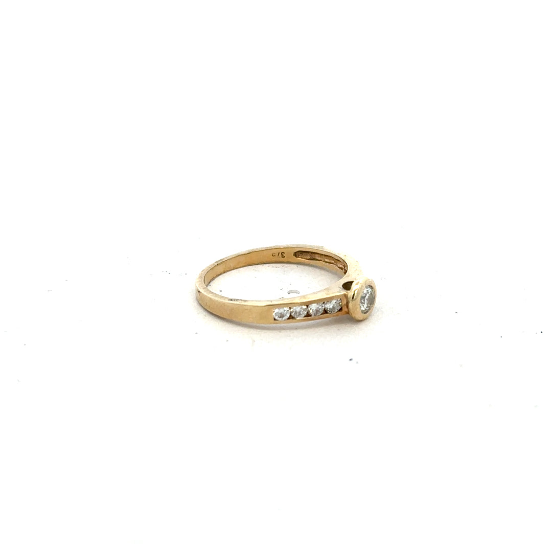 9ct yellow gold diamond ring in size N featuring a sparkling central diamond, unbranded jewelry piece with intricate detailing.