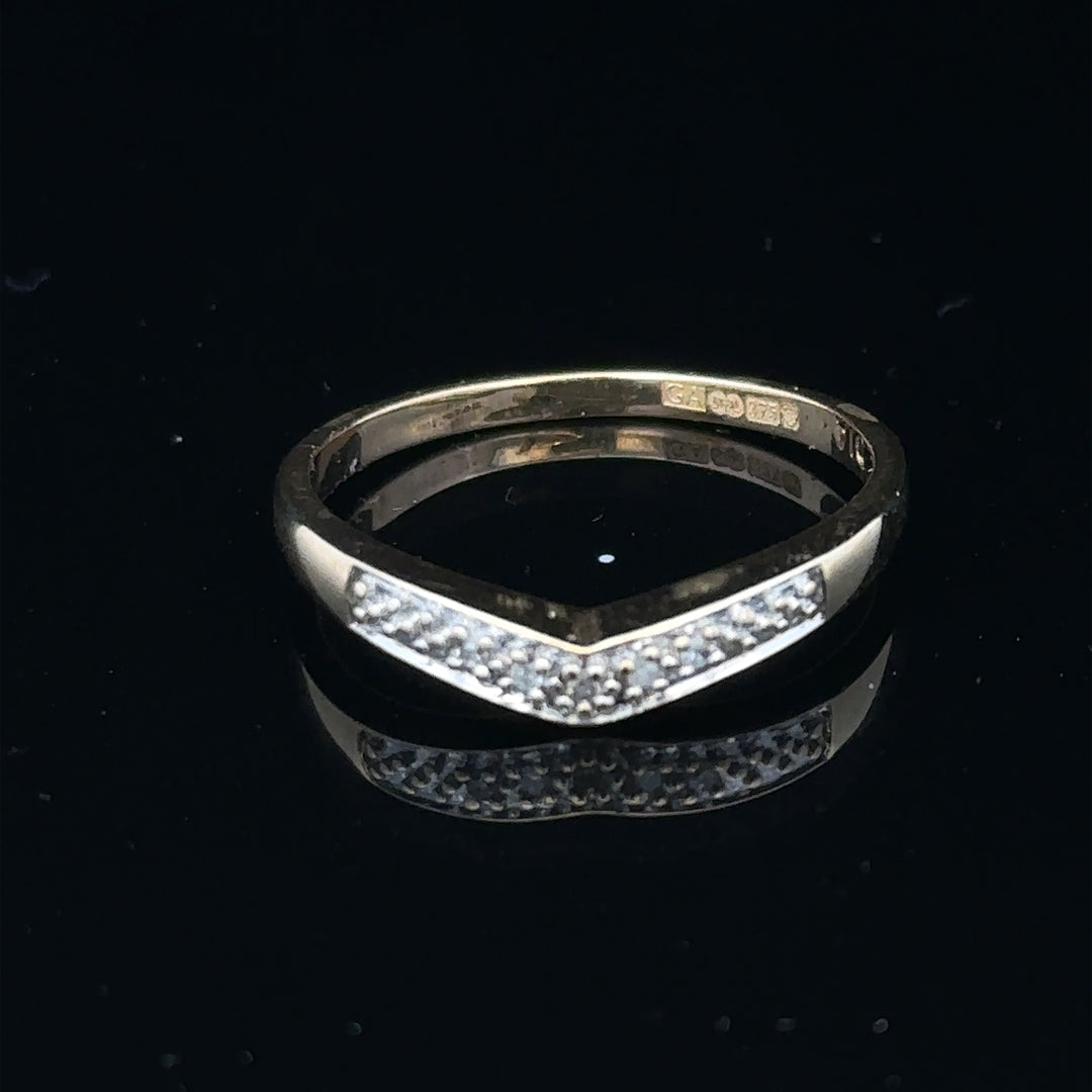 9ct yellow gold diamond ring in size P, featuring a sparkling diamond setting, displayed on a neutral background.