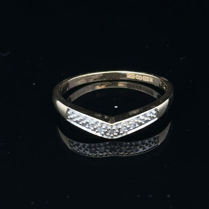 9ct yellow gold diamond ring in size P, featuring a sparkling diamond setting, displayed on a neutral background.
