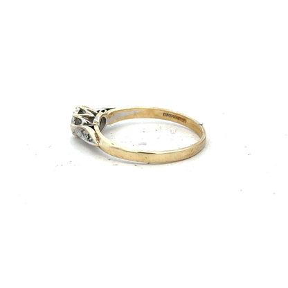 9ct yellow gold diamond ring in size P with sparkling diamonds, unbranded jewelry piece on a neutral background.