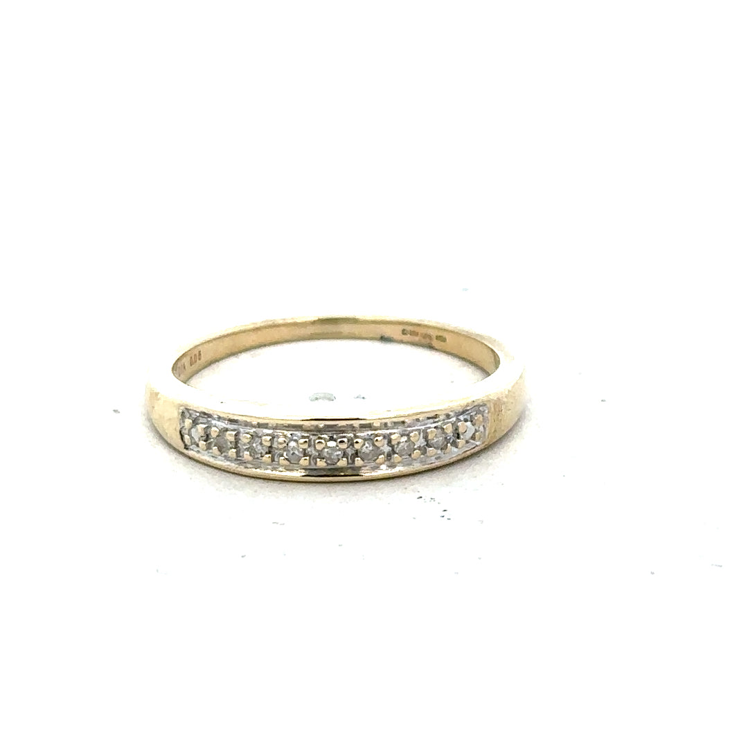 9ct yellow gold diamond ring size P with sparkling diamonds, unbranded jewelry showcasing elegant design and fine craftsmanship.