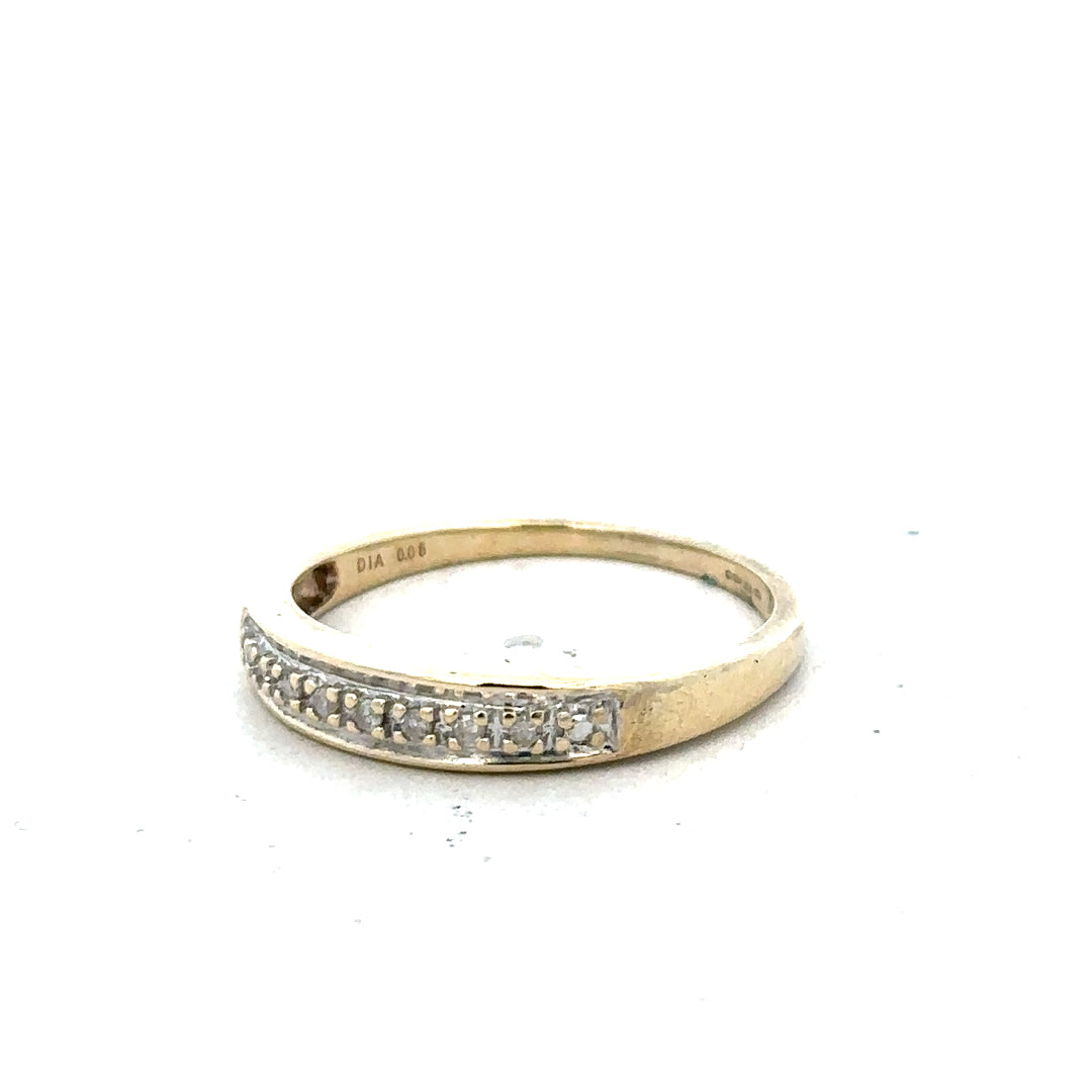 9ct yellow gold diamond ring in size P with sparkling diamonds, showcasing elegant jewelry design.