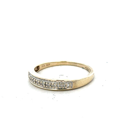 9ct yellow gold diamond ring in size P with sparkling diamonds, showcasing elegant jewelry design.