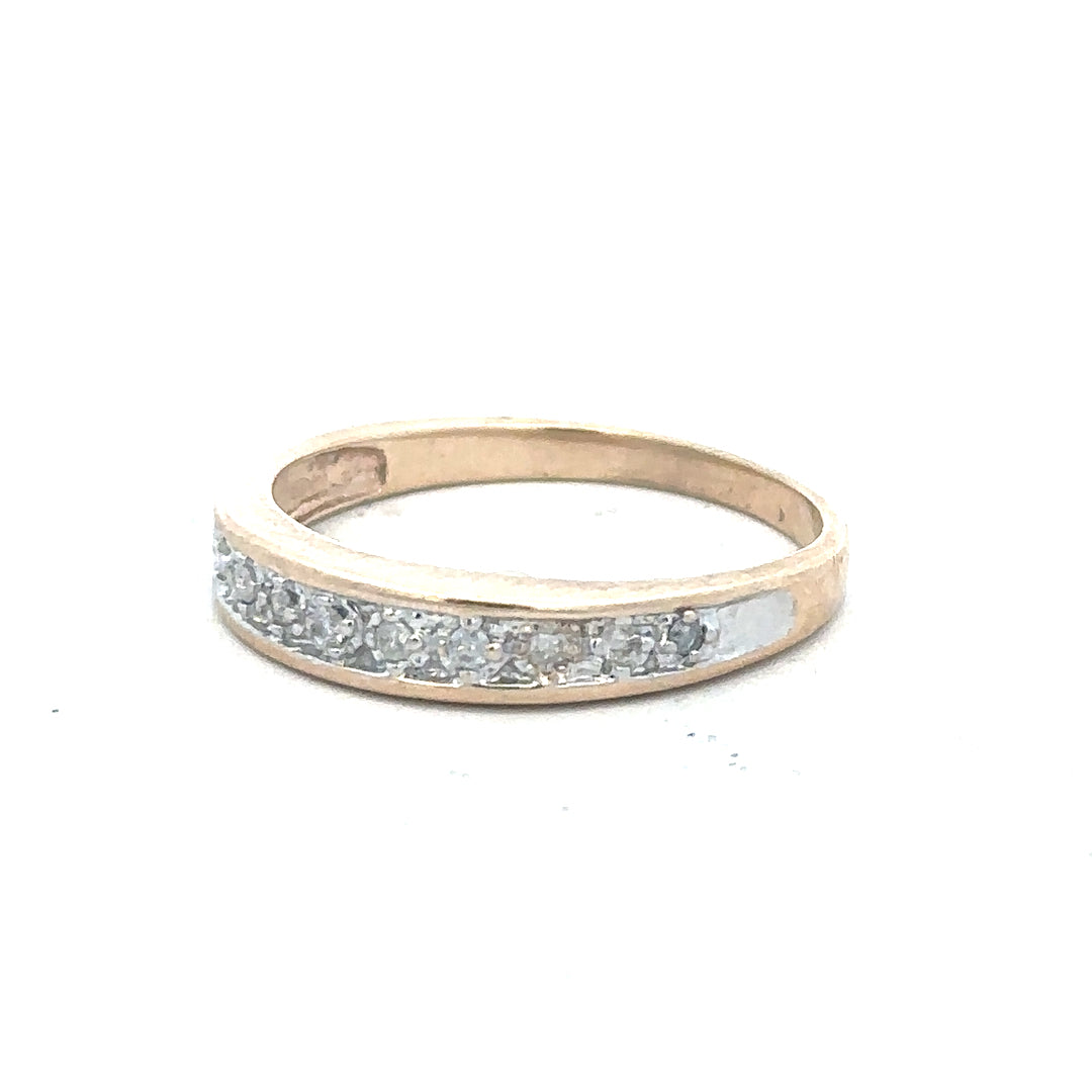 9ct yellow gold diamond ring in size Q with sparkling diamonds, unbranded jewelry piece displayed on a plain background.
