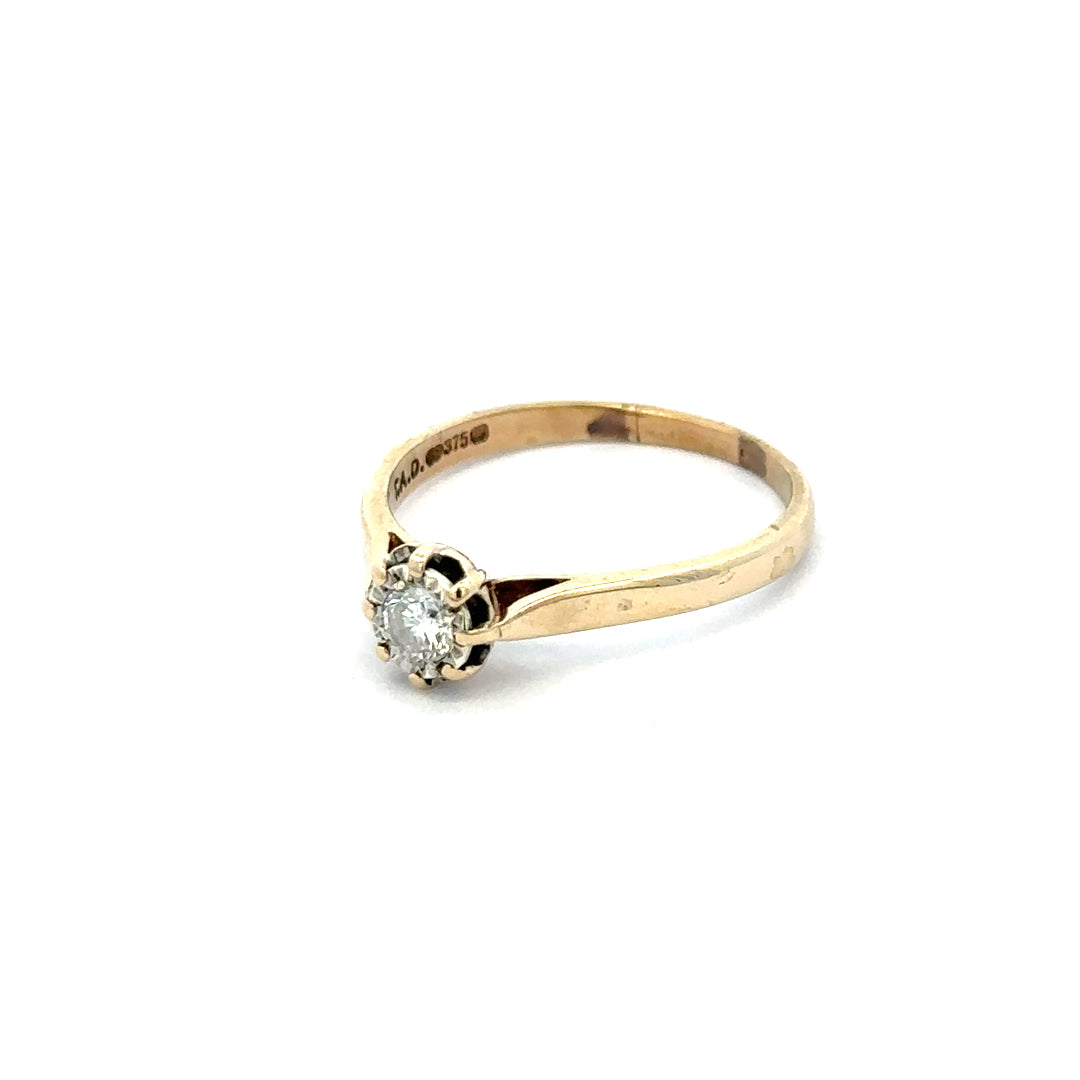 9ct yellow gold diamond ring size R with a sparkling diamond, showcasing elegant craftsmanship and a classic design.