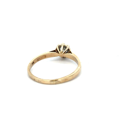 9ct yellow gold diamond ring in size R, featuring a sparkling diamond setting, unbranded jewelry displayed on a plain background.