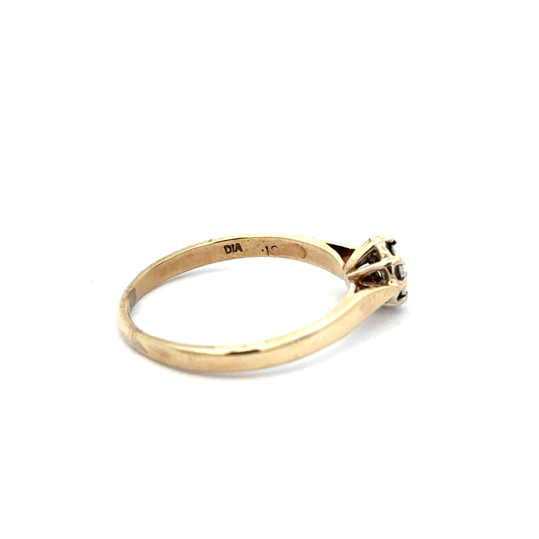 9ct yellow gold diamond ring in size R with sparkling diamonds, displayed on a neutral background.