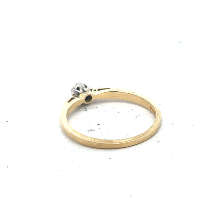 9ct yellow gold diamond solitaire ring with a single sparkling diamond set in a simple band.