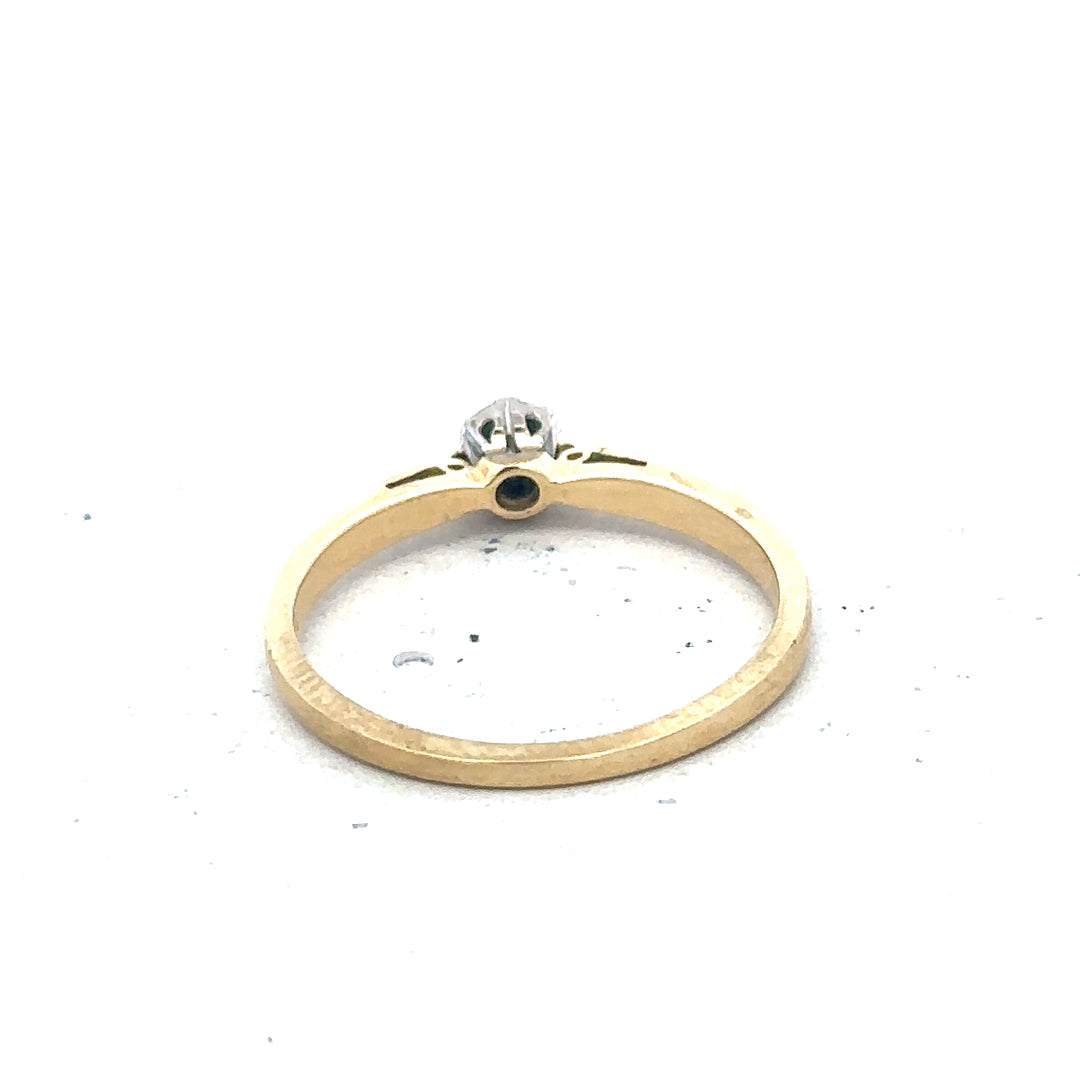 9ct yellow gold diamond solitaire ring with a sparkling central diamond and a sleek, polished band.