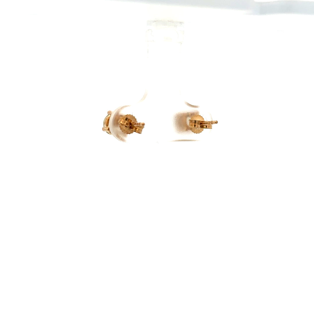 9ct yellow gold earrings weighing 1.2g, unbranded, with a classic design, shown in a close-up image highlighting the gold finish.
