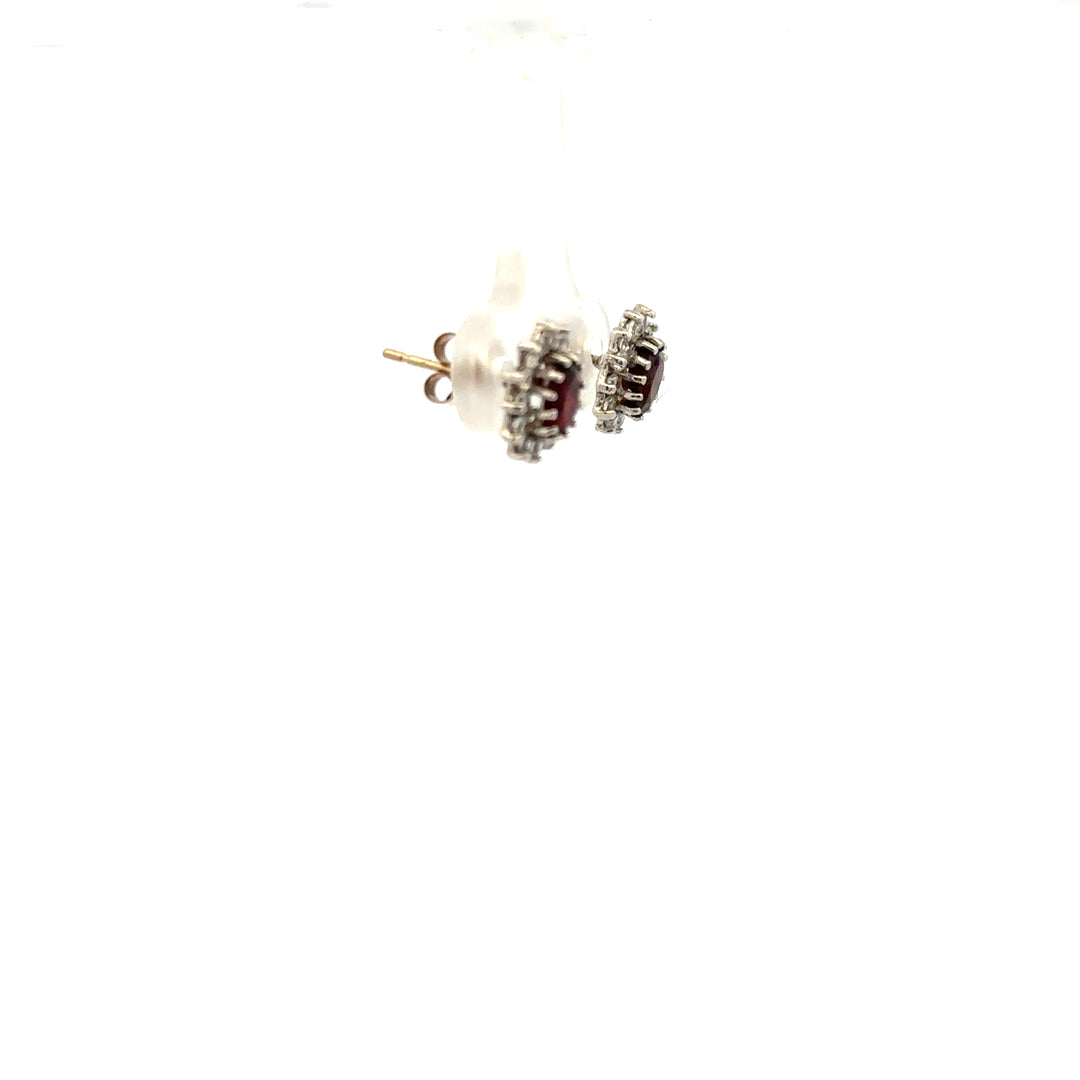9ct yellow gold earrings weighing 1.2g, unbranded, with a classic design, shown in a close-up image.