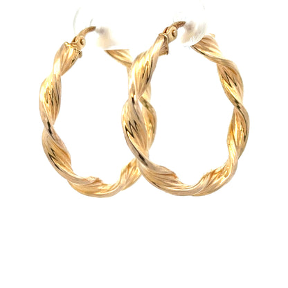 9ct yellow gold earrings weighing 1.6g, featuring a classic design, showcased on a neutral background.
