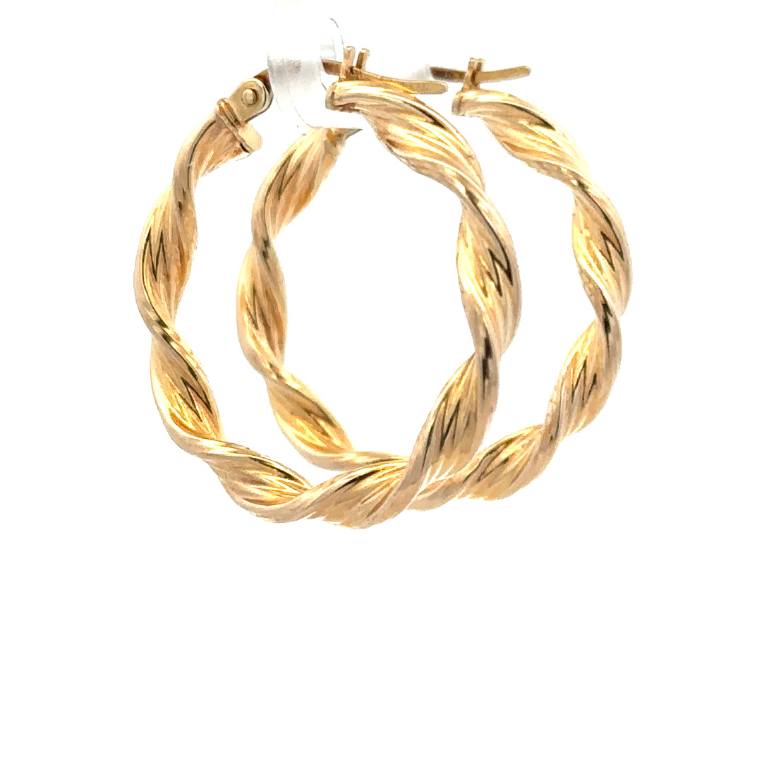 9ct yellow gold earrings with a simple design, weighing 1.6g, featuring a polished finish and secure stud backs.