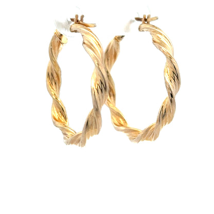 9ct yellow gold earrings, unbranded, with a sleek design, weighing 1.6 grams, shown on a neutral background.