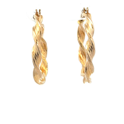 9ct yellow gold earrings weighing 1.6g, simple classic design, unbranded jewelry with a polished finish.