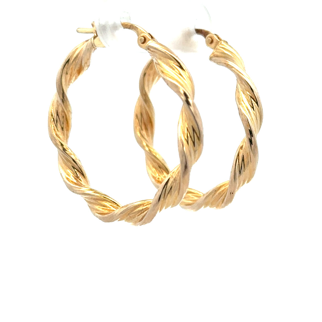 Pair of 9ct yellow gold earrings weighing 1.6g, featuring a simple and elegant design, unbranded, shown on a plain background.
