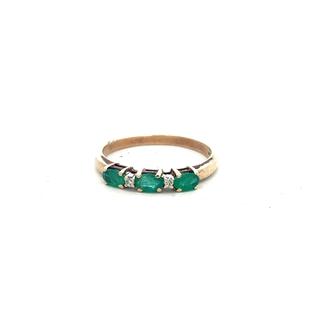 9ct yellow gold emerald and diamond ring in size T with intricate design, showcasing sparkling stones and detailed craftsmanship.