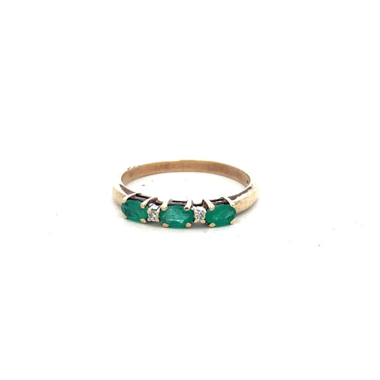 9ct yellow gold emerald and diamond ring in size T with intricate design, showcasing sparkling stones and detailed craftsmanship.