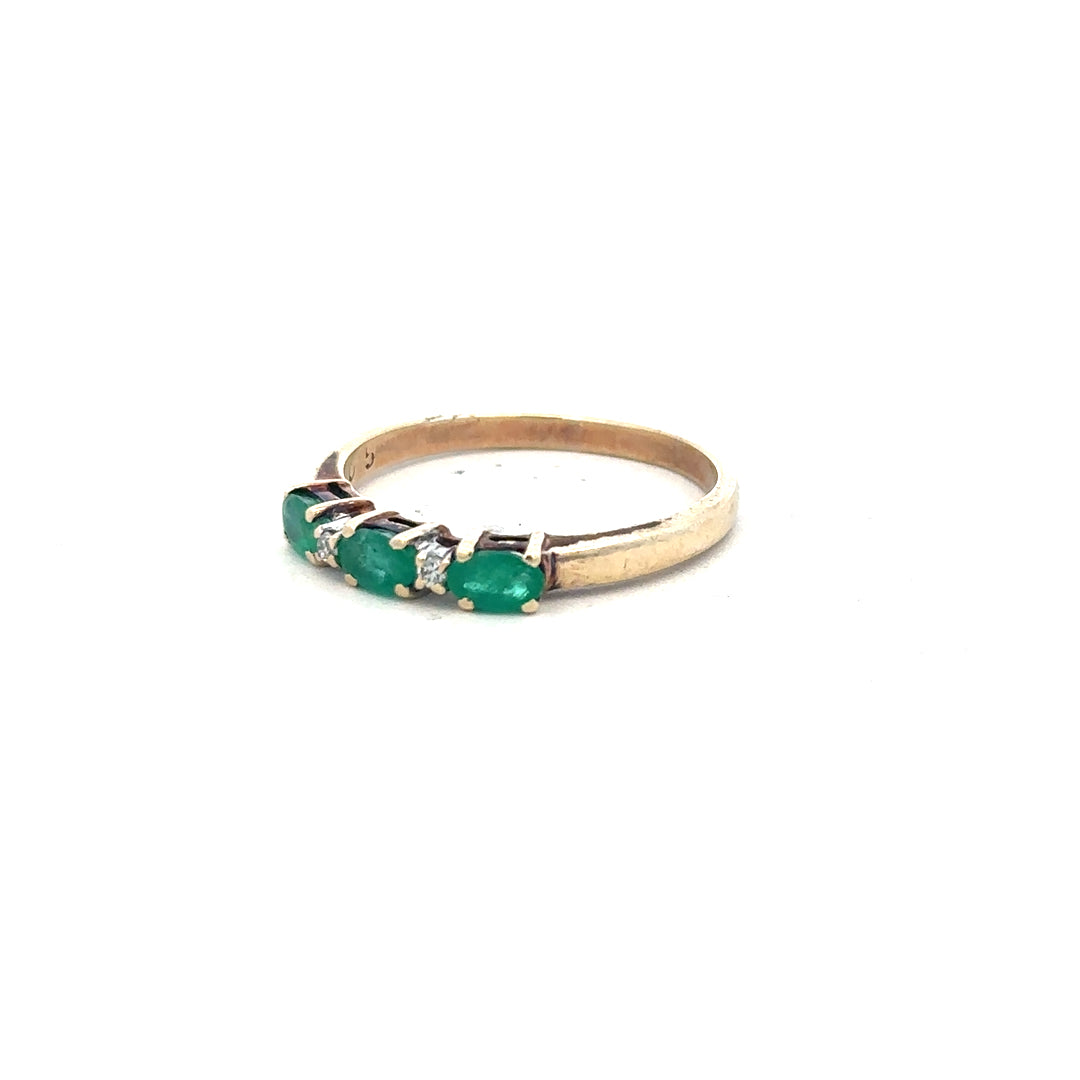 9ct yellow gold ring with emerald and diamond accents, size T, featuring intricate design and sparkling gemstones.