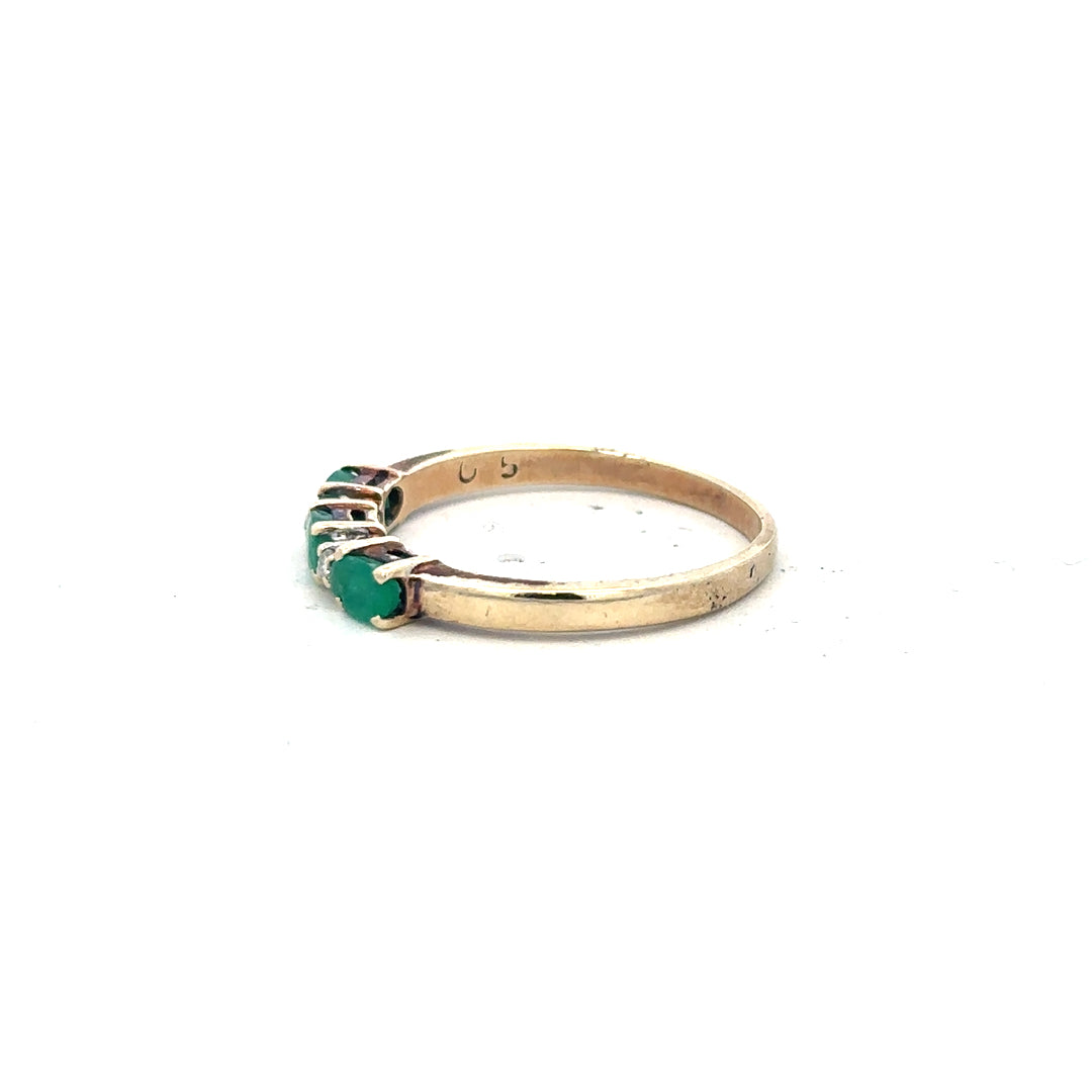 9ct yellow gold emerald and diamond ring in size T, featuring a detailed design with sparkling gemstones.