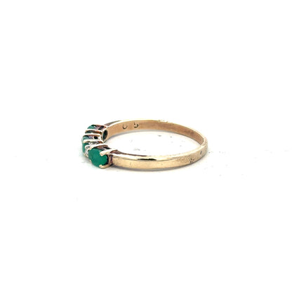 9ct yellow gold emerald and diamond ring in size T, featuring a detailed design with sparkling gemstones.