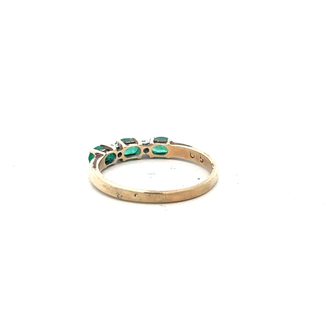 9ct yellow gold ring with emerald and diamond accents, size T, showcasing a detailed close-up of the elegant jewelry.