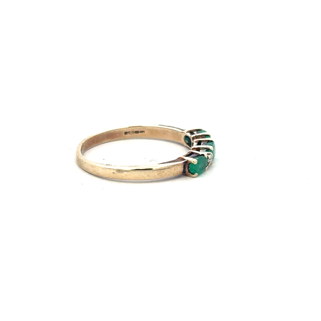 9ct yellow gold emerald and diamond ring in size T, featuring a detailed design with sparkling gemstones.