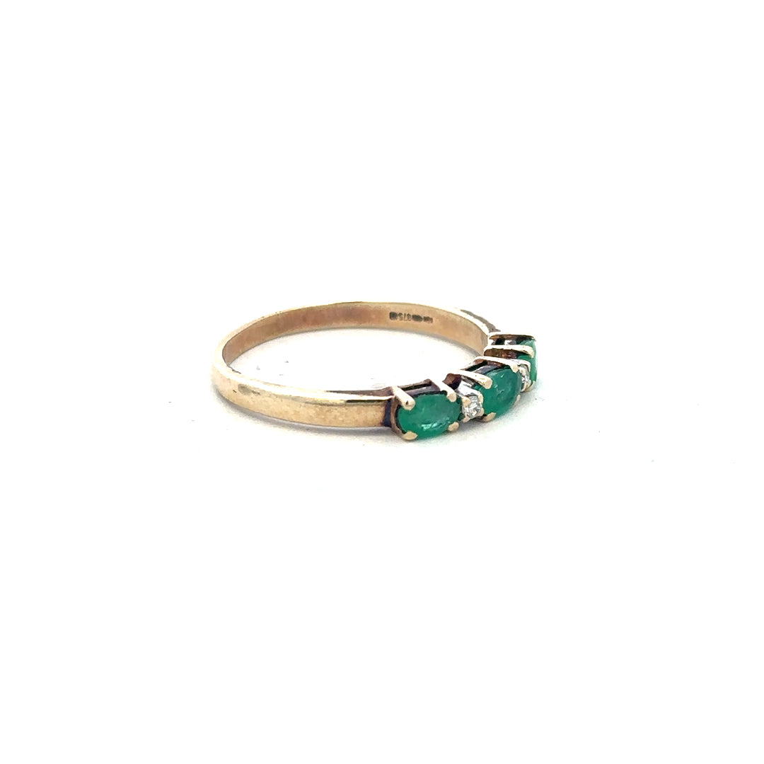 9ct yellow gold emerald and diamond ring in size T, featuring a vibrant emerald centerpiece with sparkling diamonds.