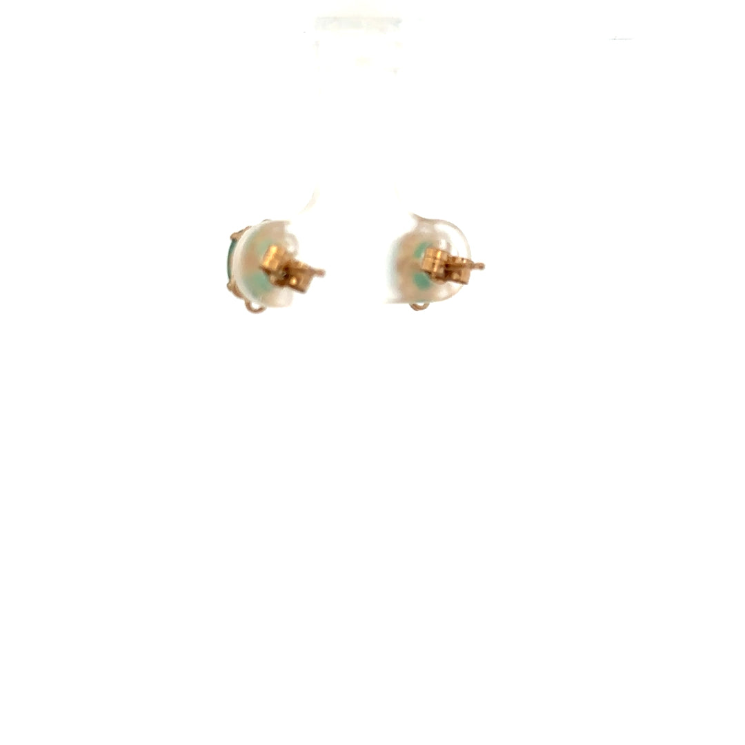 9ct yellow gold emerald earrings featuring vibrant green stones and a delicate design, weighing 0.9g, unbranded.