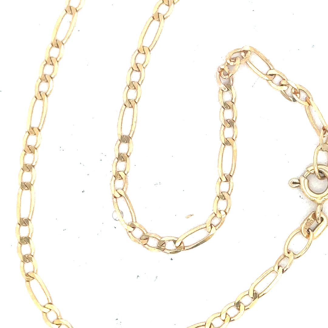 9ct yellow gold figaro bracelet, unbranded, with a sleek chain design, weighing 1.5g, shown in a close-up view.