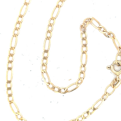 9ct yellow gold figaro bracelet, unbranded, with a sleek chain design, weighing 1.5g, shown in a close-up view.