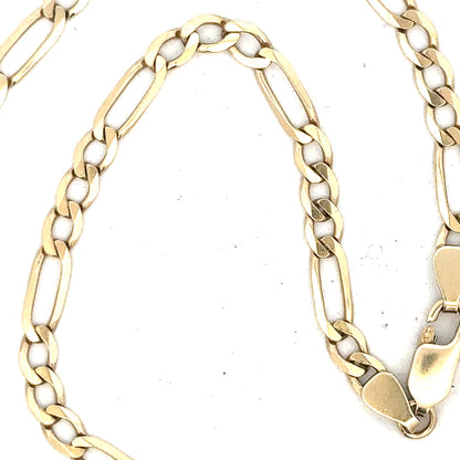 Unbranded 9ct yellow gold figaro chain with 11g weight, featuring interlinked oval links, displayed on a plain background.
