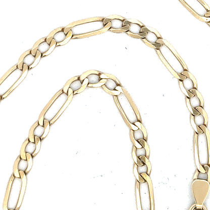 9ct yellow gold figaro chain, unbranded, 11g, with detailed links, displayed on a plain background.