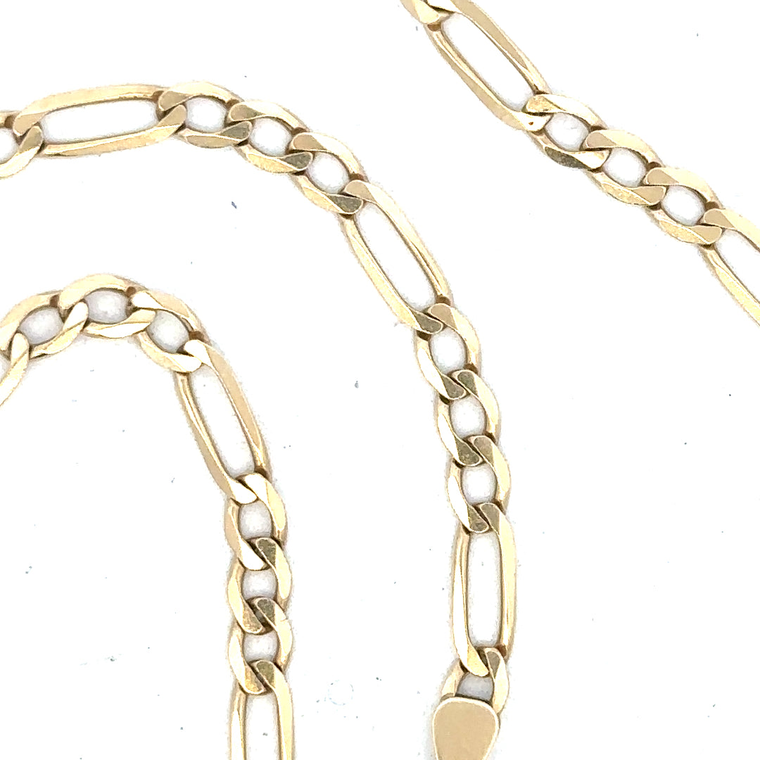 9ct yellow gold figaro chain, unbranded, with 11g weight, displayed on a plain background showing the chain's links and shine.