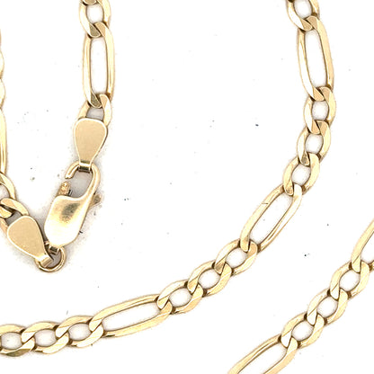9ct yellow gold figaro chain, unbranded, with 11g weight, featuring distinctive linked design, shown in close-up view.