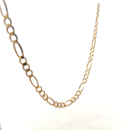 9ct yellow gold Figaro chain, unbranded, with a polished finish and intricate links, weighing 12.7 grams.