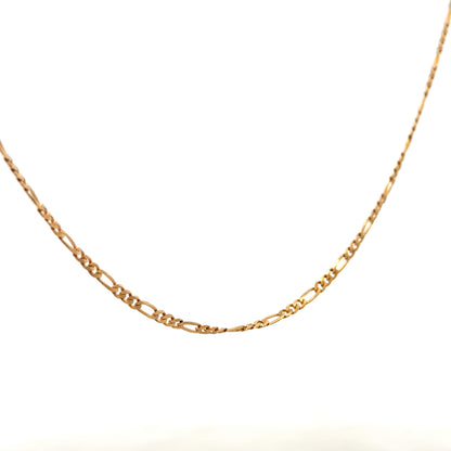 9ct yellow gold figaro chain, unbranded, showing its detailed link design and polished finish on a white background.