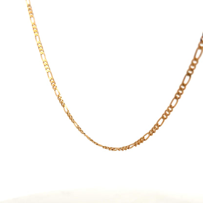 9ct yellow gold figaro chain with a polished finish, showcasing its linked chain design and lightweight 3.7g weight.