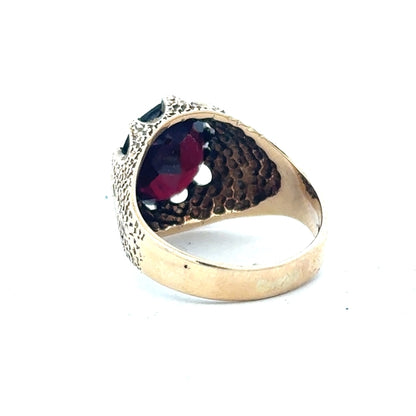 9ct yellow gold garnet ring, size N1/2, featuring a vibrant garnet gemstone set in a simple gold band.