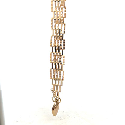 9ct yellow gold gate bracelet with a polished finish, weighing 5.8g, featuring a classic chain link design.