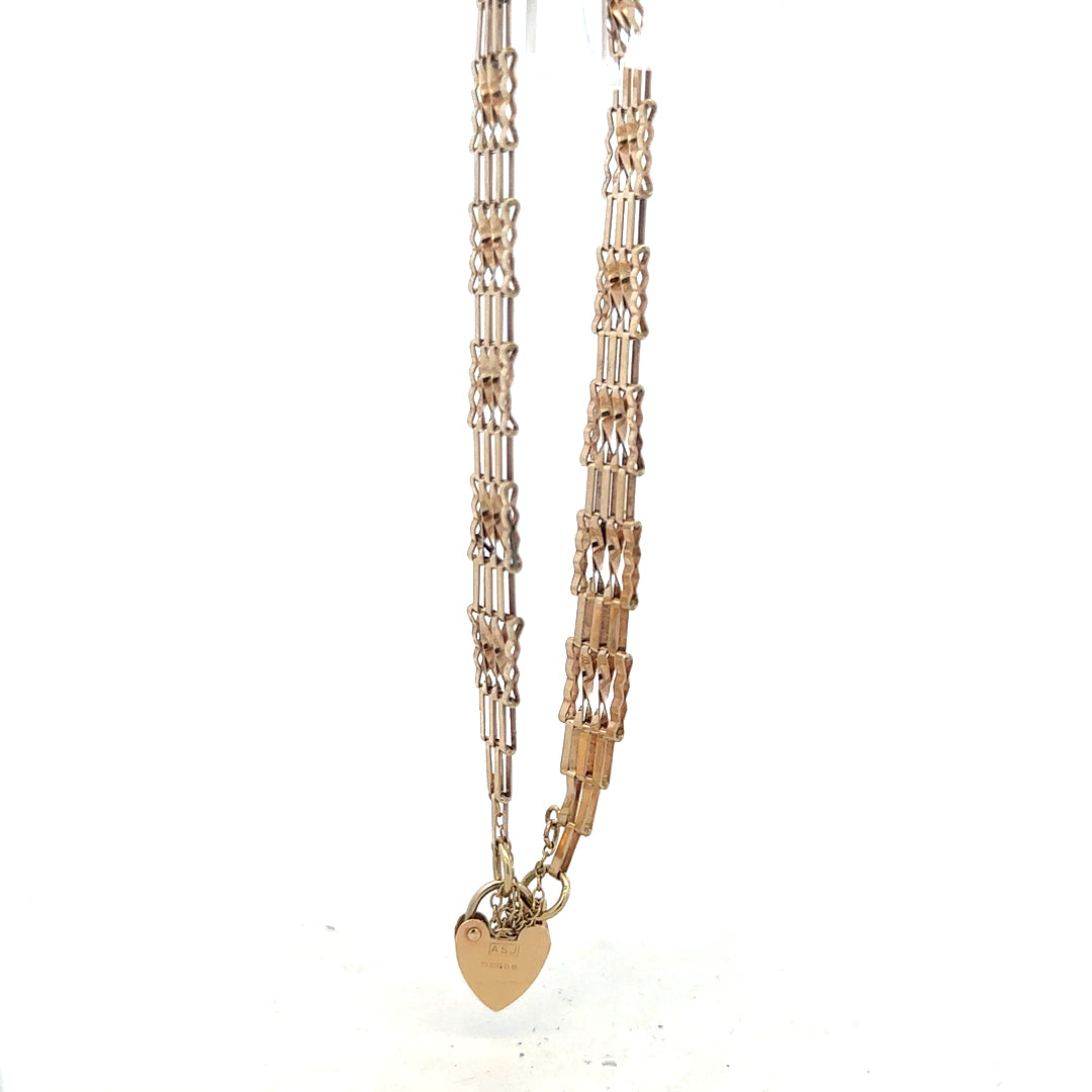 9ct yellow gold gate bracelet weighing 5.8g, unbranded jewelry piece with a classic link design.