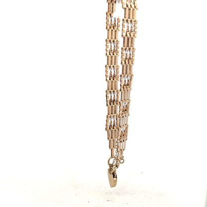 9ct yellow gold gate bracelet with a secure clasp, weighing 5.8g, featuring a classic chain design, unbranded jewelry accessory.